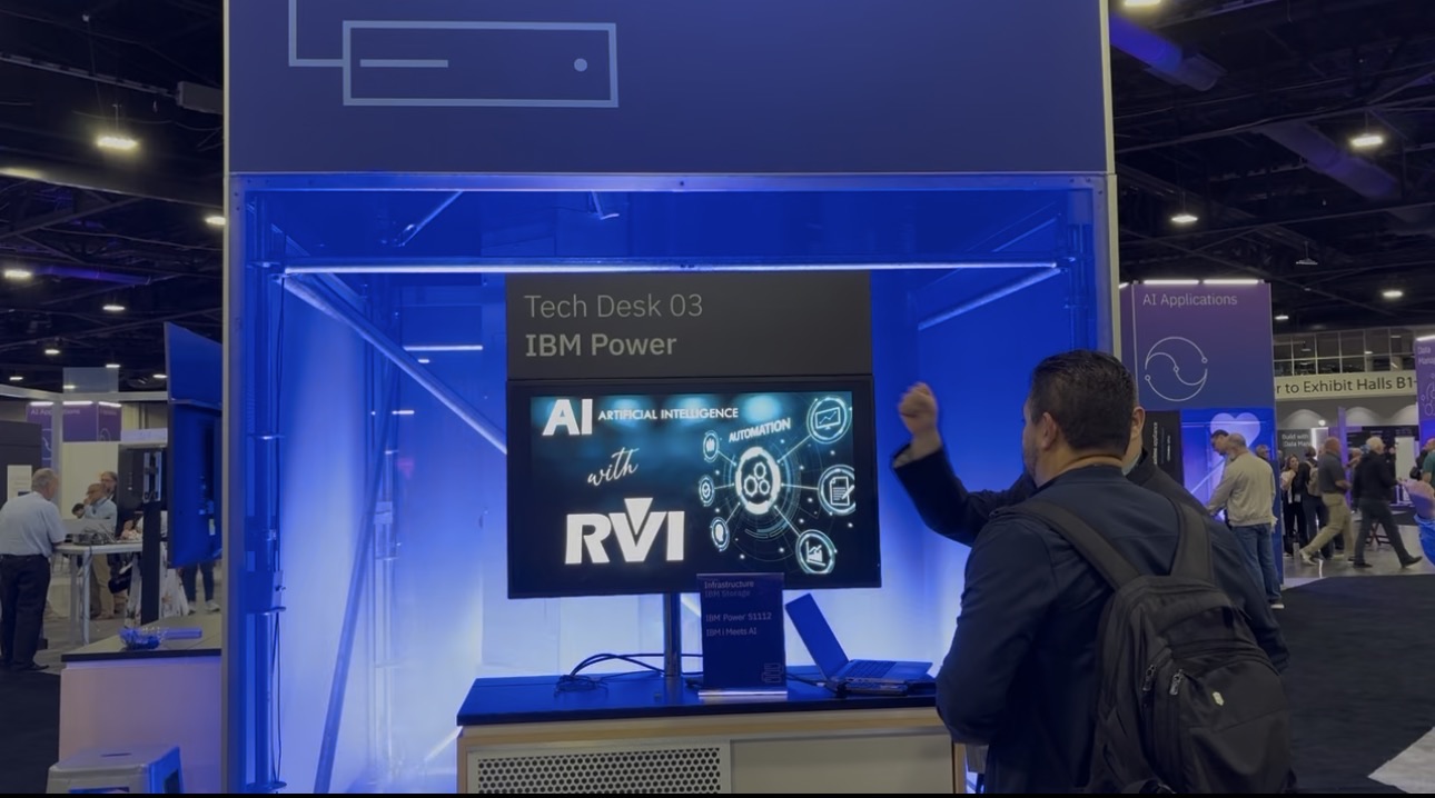 An RVI video, AI with RVI, playing on the screen at the IBM Power tech desk at IBM TechXchange 2026
